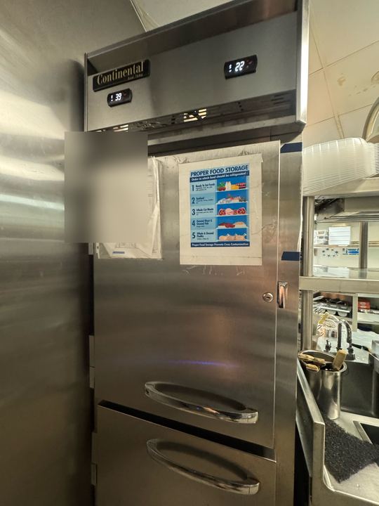 Stainless Continental commercial reach-in refrigerator with digital temperature displays, paper log blurred