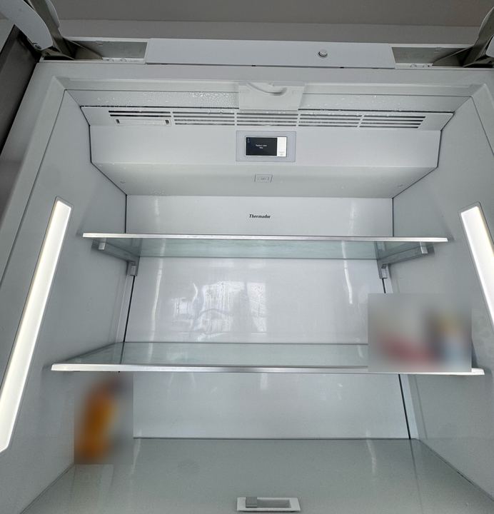 Thermador built-in refrigerator interior after the repair, clean and free of ice